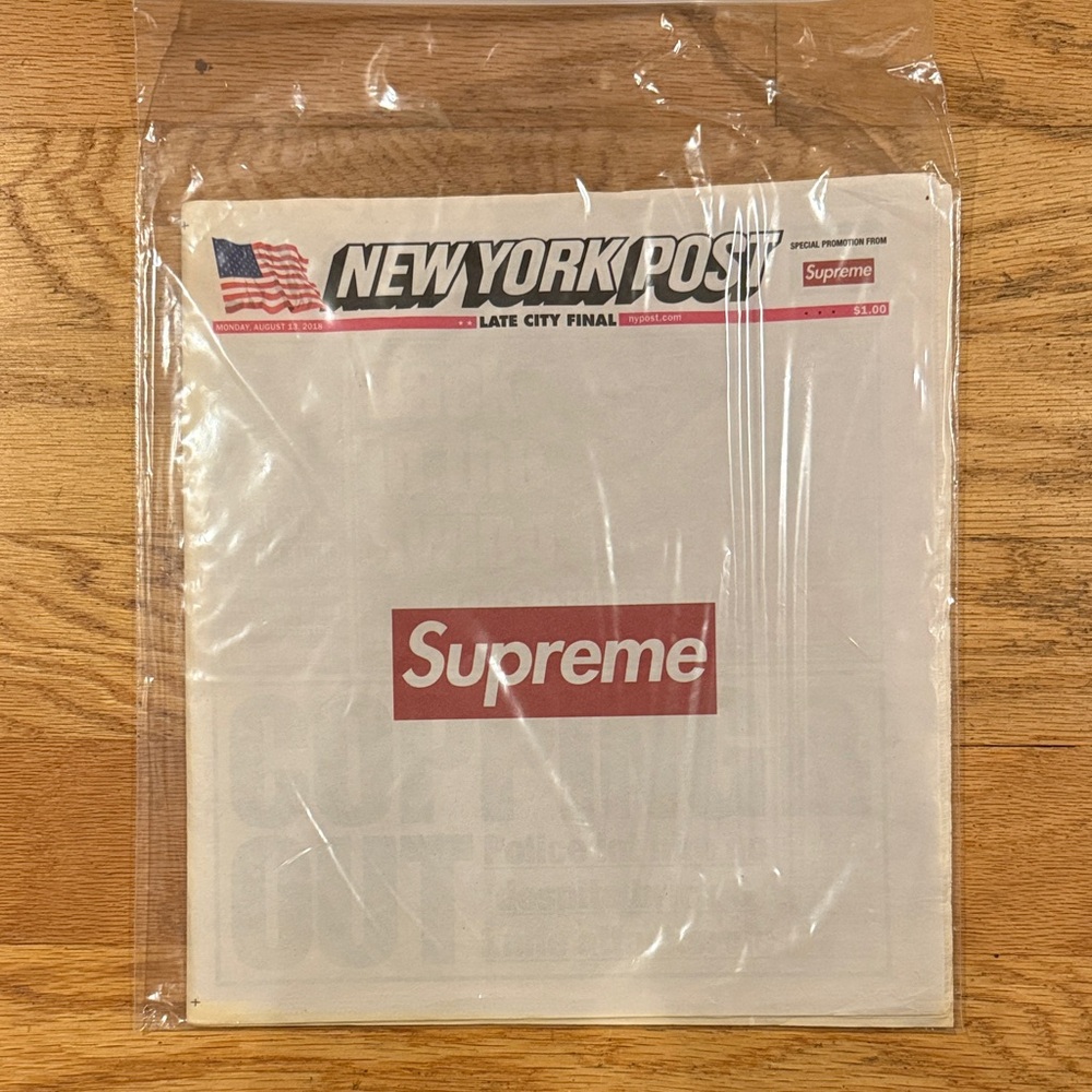 Supreme Red and White Branded Newspaper
